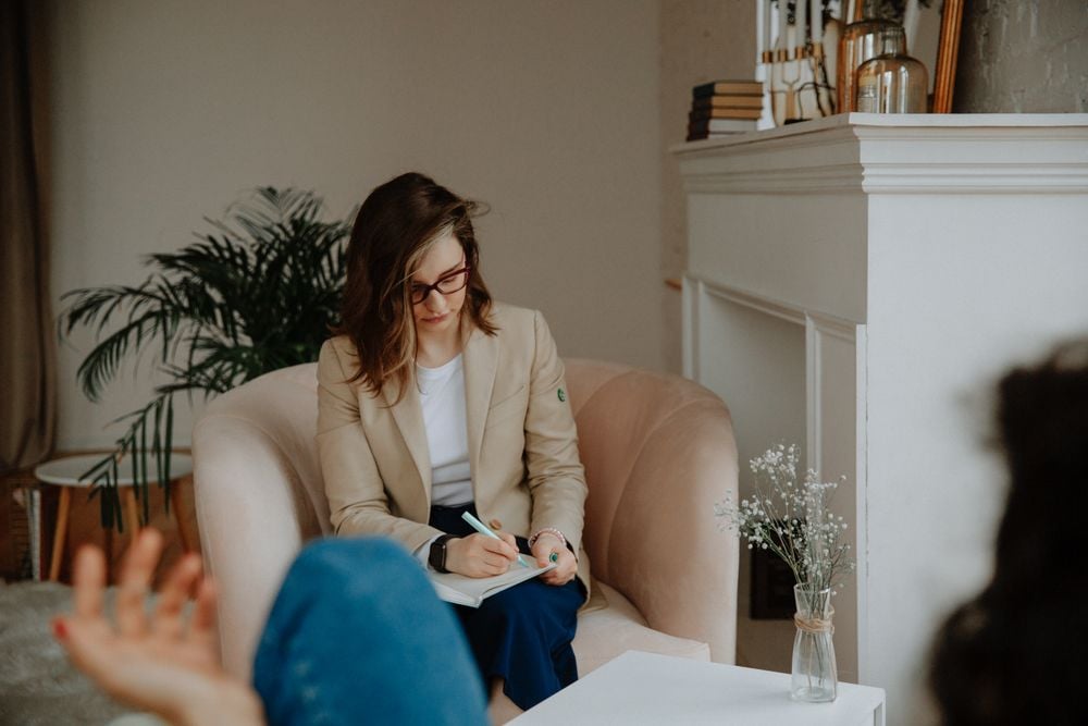 Therapist and client talking during a counseling session about healthy boundaries